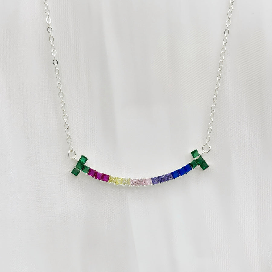 The 925 silver necklaces feature a rainbow smiling face-shaped adorned pendant with colorful and vibrant cubic zirconia stones. The necklace can be beautifully layered for a stunning stacked effect that adds a burst of color and joy to your style.