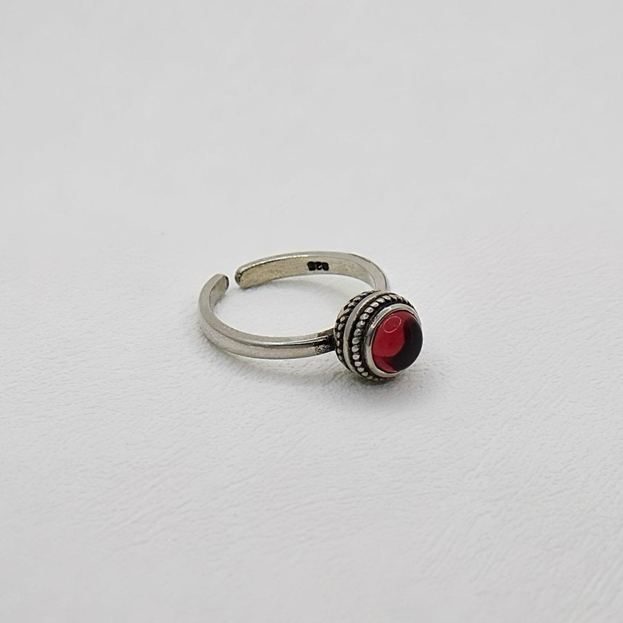 The adjustable vintage ring features a red stone that adds a touch of retro charm and elegance to any outfit. Handmade in 925 silver