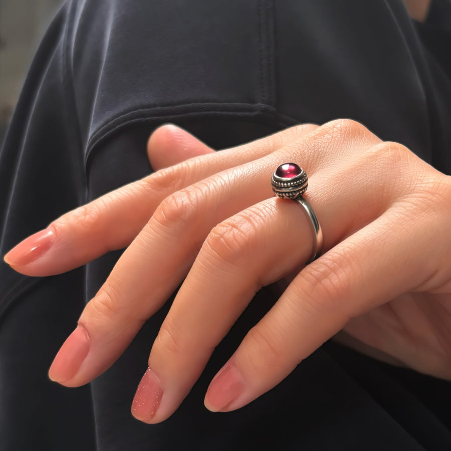 The adjustable vintage ring features a red stone that adds a touch of retro charm and elegance to any outfit. Handmade in 925 silver