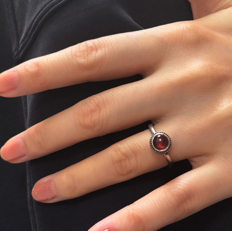 The adjustable vintage ring features a red stone that adds a touch of retro charm and elegance to any outfit. Handmade in 925 silver