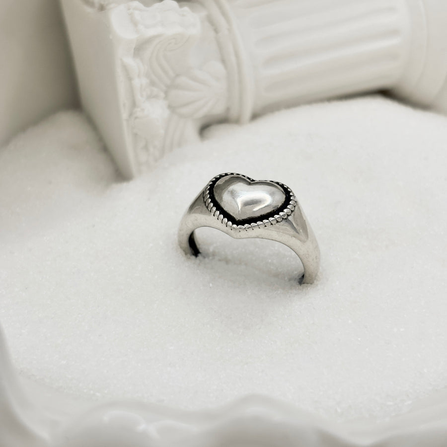 925 Silver Ring. This ring is made of pure silver and features a heart-shaped design with a punk style. It is perfect for adding a touch of edginess to any outfit. The ring is adjustable.