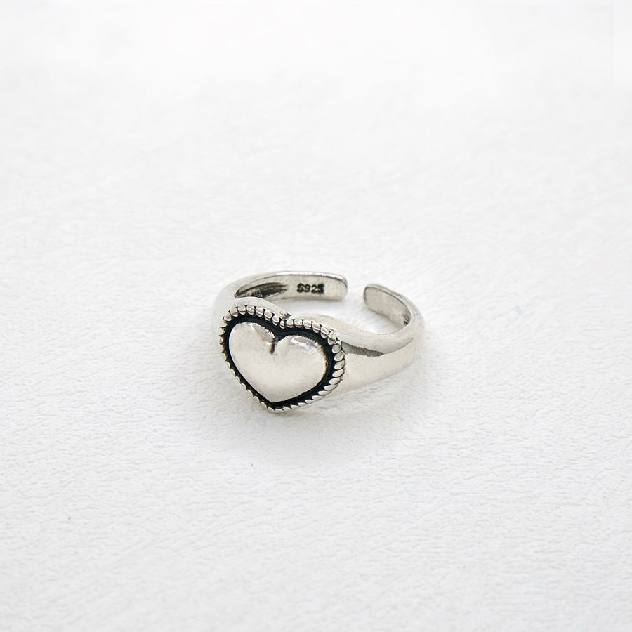 925 Silver Ring. This ring is made of pure silver and features a heart-shaped design with a punk style. It is perfect for adding a touch of edginess to any outfit. The ring is adjustable.