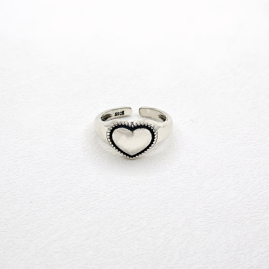 925 Silver Ring. This ring is made of pure silver and features a heart-shaped design with a punk style. It is perfect for adding a touch of edginess to any outfit. The ring is adjustable.