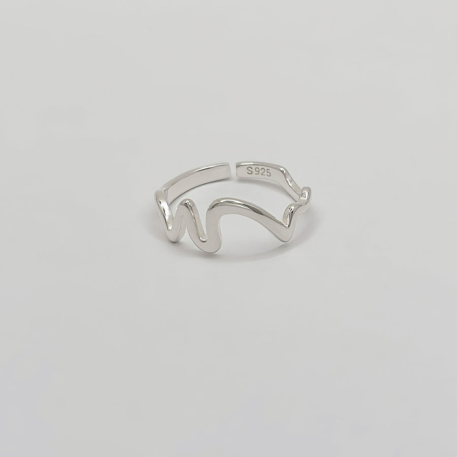 This unique 925 sterling silver ring features a wave-inspired open design, combining modern aesthetics with artistic flair. Adjustable and lightweight, this ring is a versatile accessory that complements any casual or formal look. 