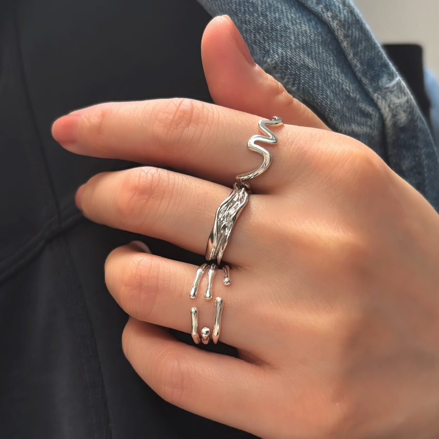 This unique 925 sterling silver ring features a wave-inspired open design, combining modern aesthetics with artistic flair. Adjustable and lightweight, this ring is a versatile accessory that complements any casual or formal look. 