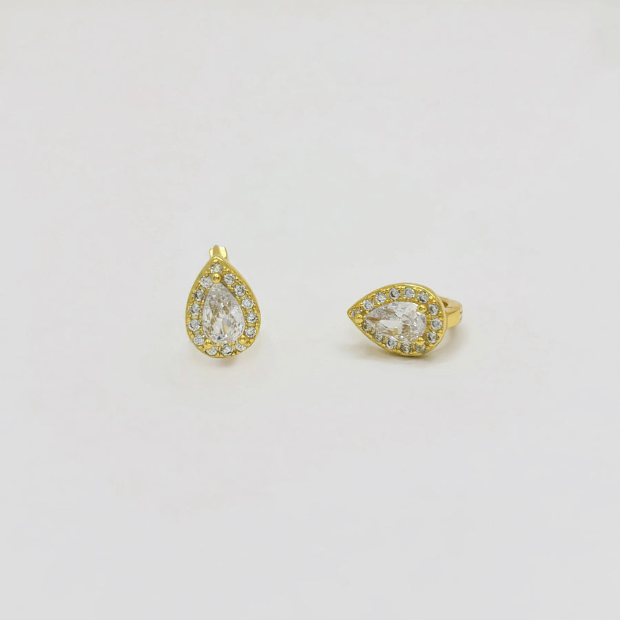 Crafted with elegance in mind, these teardrop-shaped earrings feature a dazzling central cubic zircon surrounded by a halo of shimmering cubic zircon. Perfect for adding a touch of glamour to any outfit