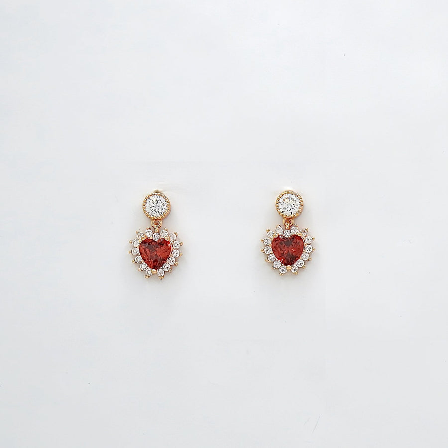 These exquisite 925 silver earrings feature a stunning heart-shaped red cubic zircon, surrounded by a halo of sparkling white cubic zircon, adding a touch of elegance and romance to any outfit. Perfect for any occasions.