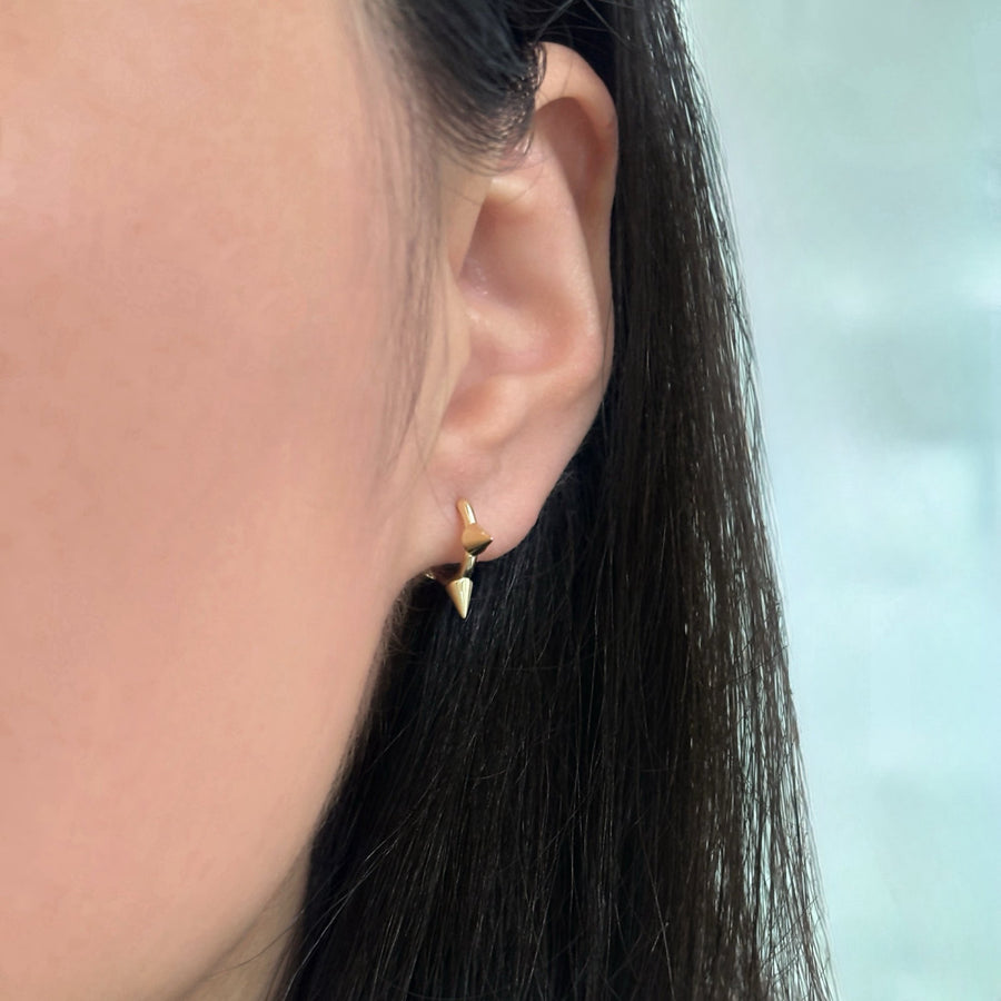 Featuring sleek gold finishes and edgy spike details, these earrings are the perfect statement piece to elevate your style with confidence and flair. perfect for both everyday wear and special occasions.