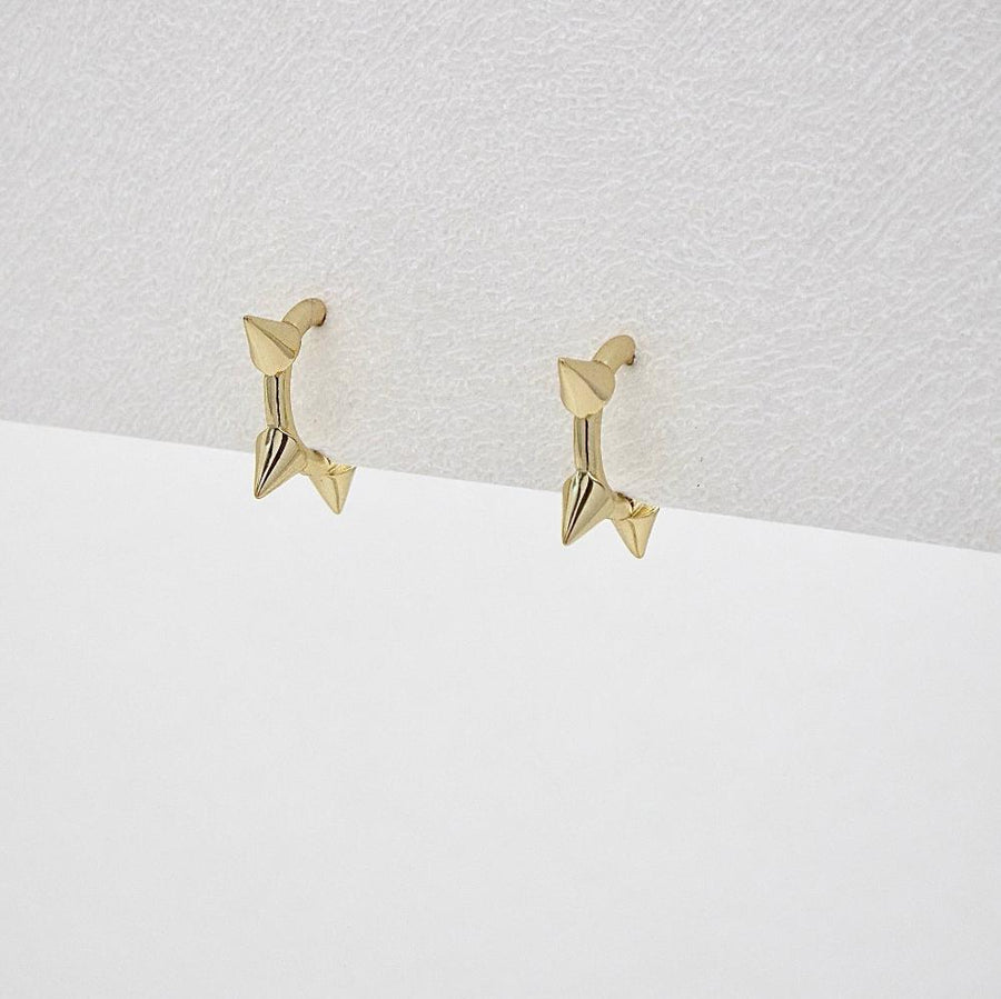 Featuring sleek gold finishes and edgy spike details, these earrings are the perfect statement piece to elevate your style with confidence and flair. perfect for both everyday wear and special occasions.