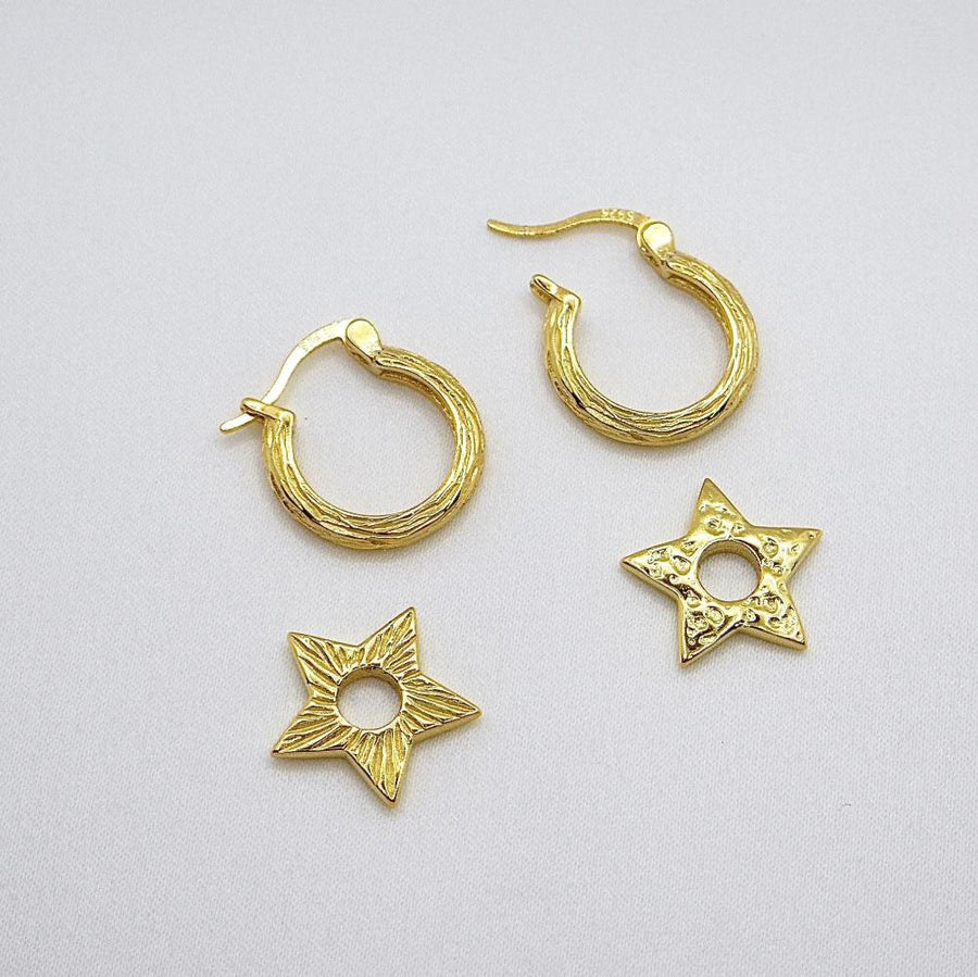 These exquisite star-shaped earrings are crafted from high-quality silver, featuring a unique textured design that adds a touch of elegance and sophistication to any outfit. Perfect for both casual and formal occasions, these earrings are a must-have accessory for those who love to shine.