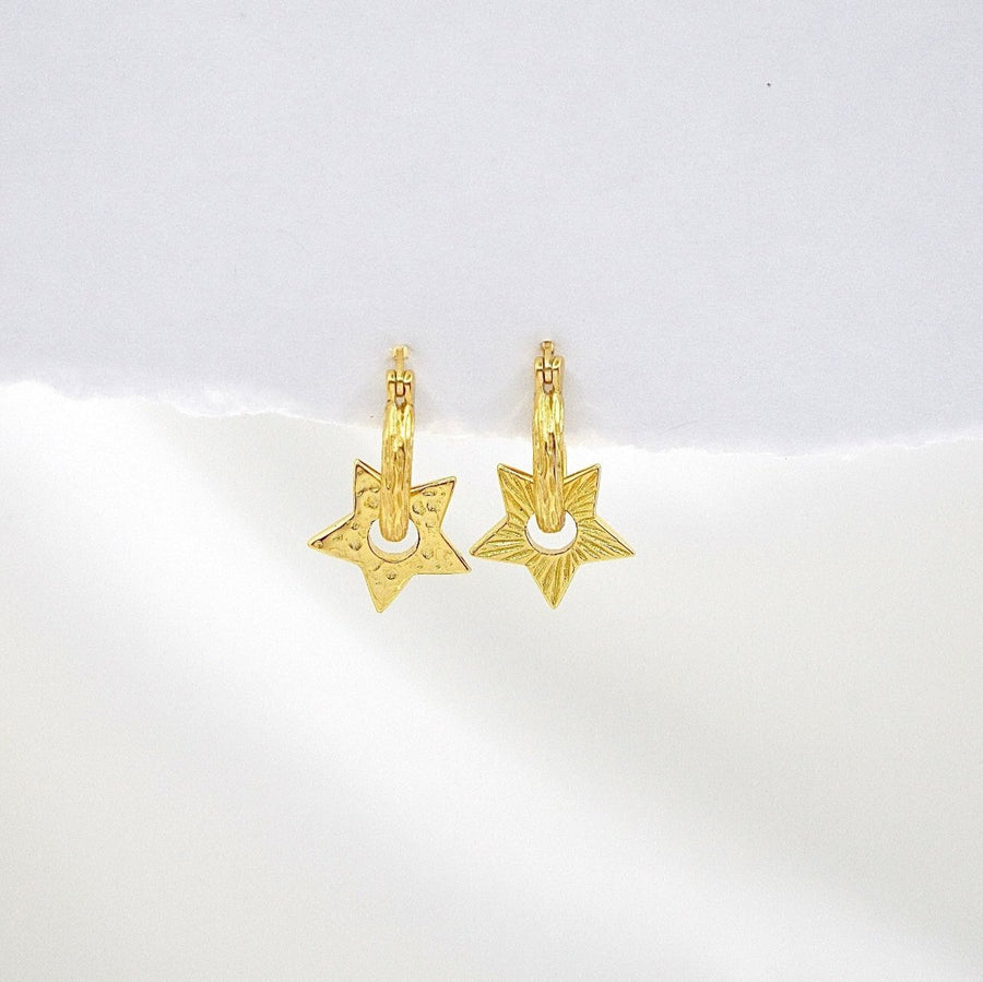 These exquisite star-shaped earrings are crafted from high-quality silver, featuring a unique textured design that adds a touch of elegance and sophistication to any outfit. Perfect for both casual and formal occasions, these earrings are a must-have accessory for those who love to shine.