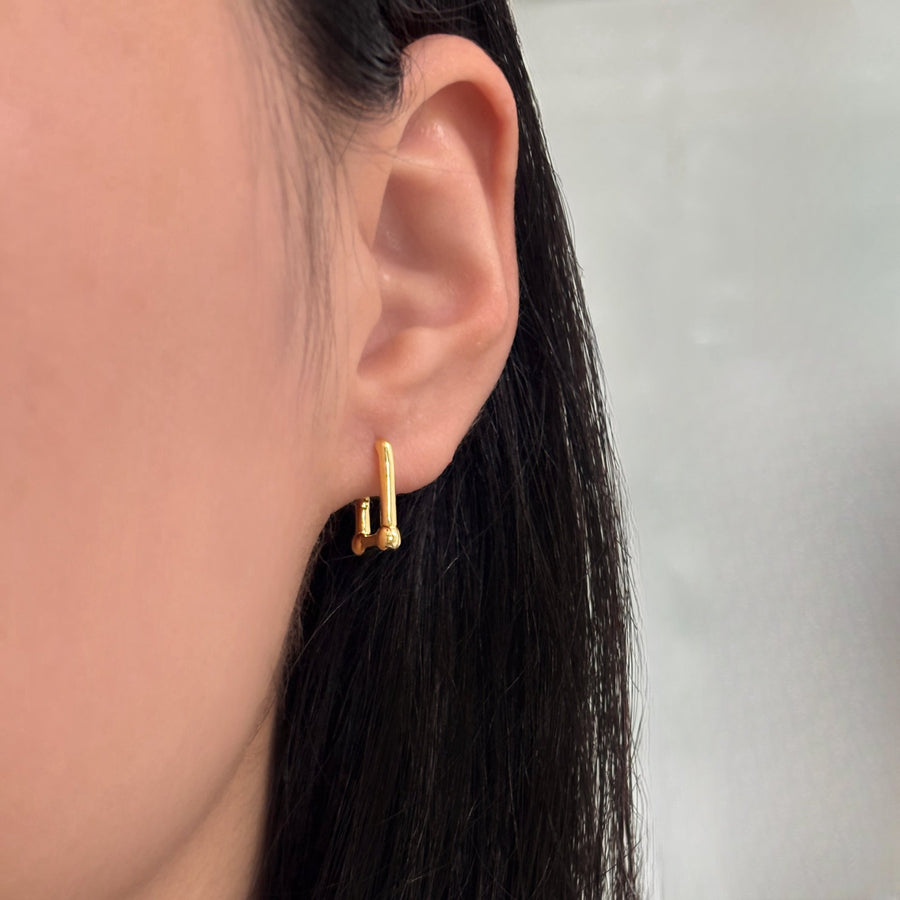 These U-shaped earrings are crafted from high-quality 925 silver, offering a sleek and modern design that complements any outfit. The unique U-shape and secure clasp ensure both style and comfort for everyday wear.