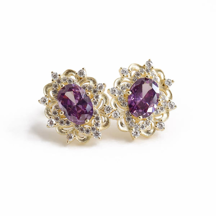 Silver Stud Earrings. Elevate your elegance with these dazzling gold earrings, featuring vibrant purple gemstones surrounded by sparkling cubic zirconia. Perfect for adding a royal touch to your look, whether for everyday wear or special occasions.