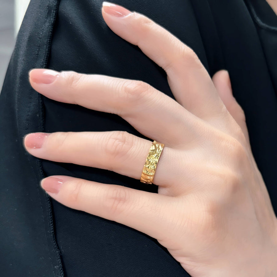 This Classic Gold Flat Band Ring showcases a refined hammered finish, adding a unique artisanal touch to a minimalist design. Designed for versatility, its open-end design ensures a perfect fit for any finger size, making it a staple in any jewelry collection.