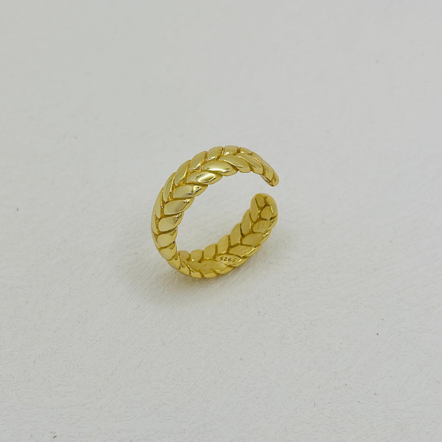 The gold vermeil braided ring blends modern style with a bold wheat braid pattern, making it the perfect statement accessory for any outfit. silver ring