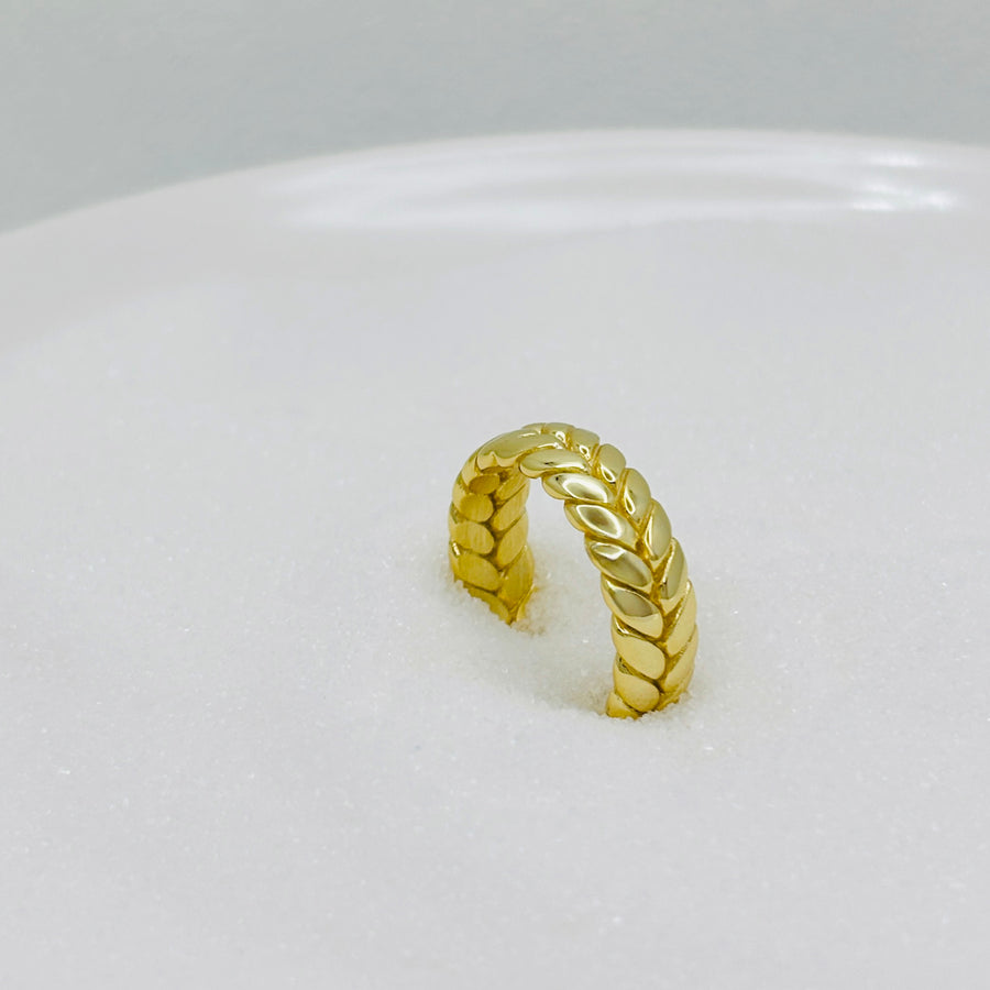 The gold vermeil braided ring blends modern style with a bold wheat braid pattern, making it the perfect statement accessory for any outfit. silver ring