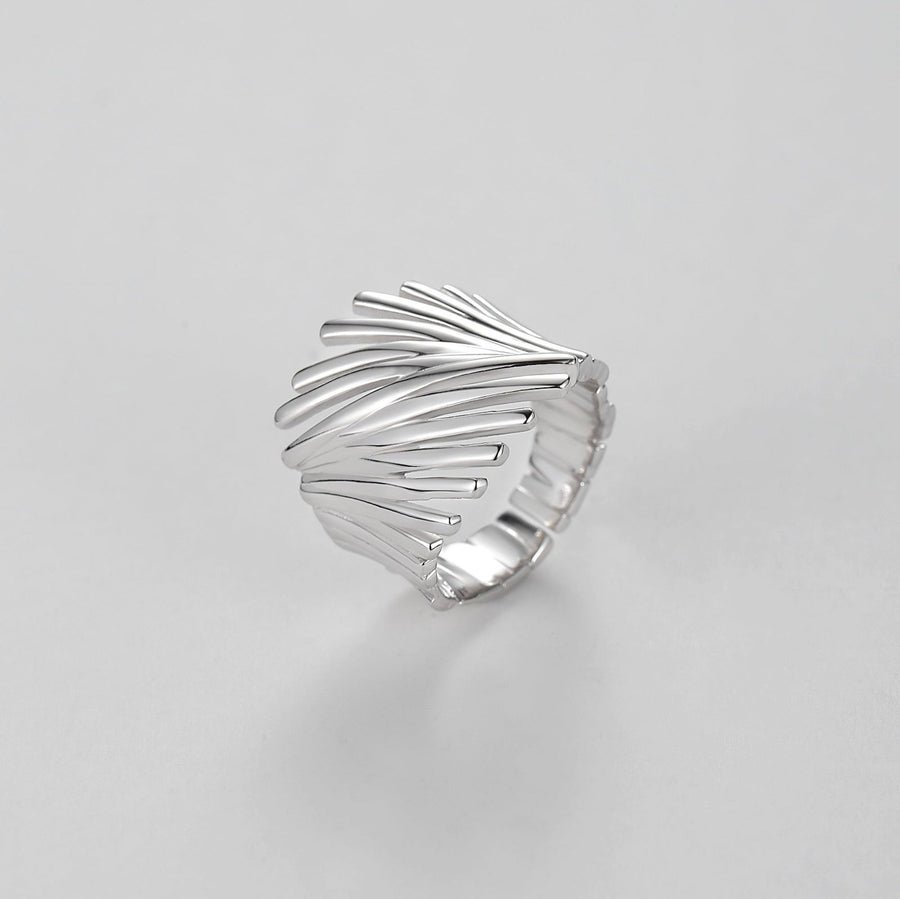 925 Sterling Silver Adjustable Ring. Featuring a unique artistic design, this ring showcases an intricate, abstract pattern of curved lines that wrap gracefully around your finger. 