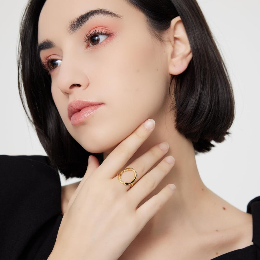 silver adjustable Ring. This open oval ring features a sleek, asymmetrical design that adds a contemporary touch to any outfit. Its adjustable open-band style 